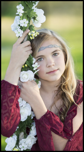 youth holding onto floral rope