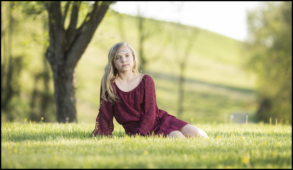 youth laying in a field - studio back yard