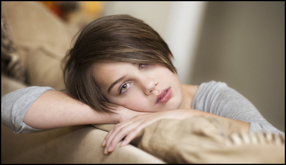 Youth laying on couch - Studio waiting room 